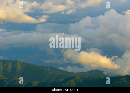 Sunlight breaks through the monsoon clouds building around the Kathmandu valley Stock Photo