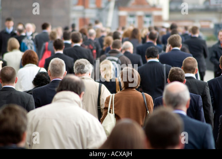 Large crowd of commuters on their way from work during rush hour in the City of London, England, UK Stock Photo