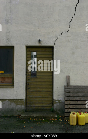 damaged plaster on building wall Stock Photo