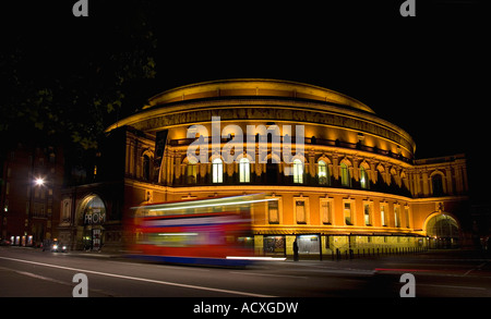 Royal Albert Hall in evening with red double decker double-decker bus at night nighttime London England UK United Kingdom GB Stock Photo