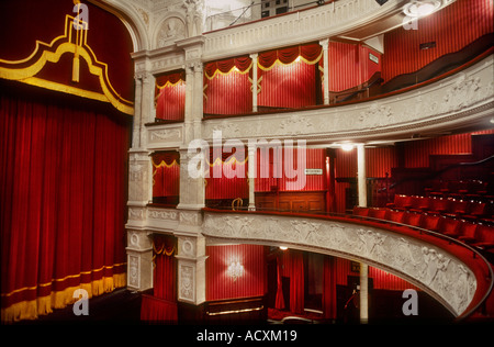 Side view of theatre boxes and stage curtain in the interior auditorium of Garrick Theatre London Stock Photo