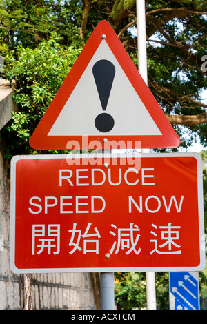 Reduce Speed Now Warning Street Sign in China Stock Photo