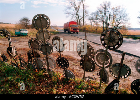 The sale of hub caps on a roadside, Poland Stock Photo