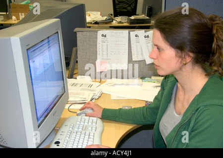 Office worker using a computer. Stock Photo