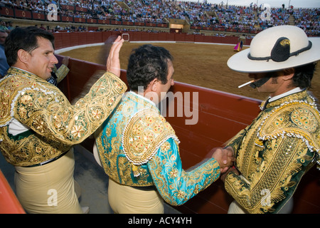 Picadors (horsemen) shaking hands after a bullfight, Spain Stock Photo