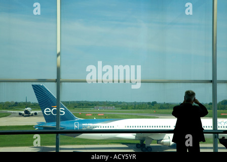 Man waiting at the boarding gate. Stansted airport. UK Stock Photo