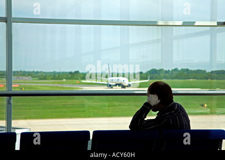 Man waiting at the boarding gate. Stansted airport. UK Stock Photo