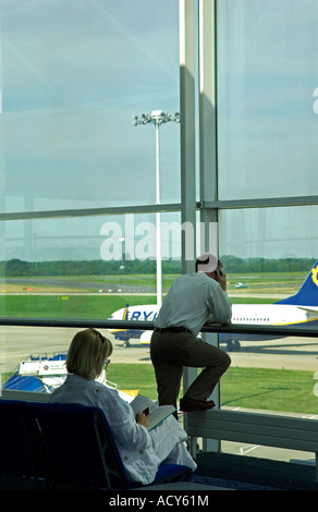 People waiting at the boarding gate. Stansted airport. UK Stock Photo