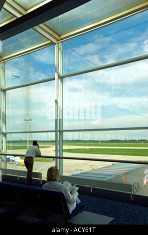 People waiting at the boarding gate. Stansted airport. UK Stock Photo