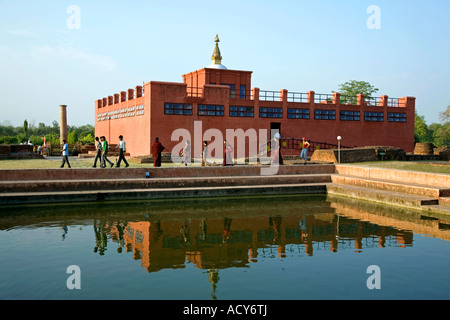 Pilgrims at Maya Devi Temple and sacred pond.Lumbini.Birthplace of Lord Buddha.Nepal Stock Photo