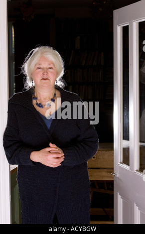Writer author Barbara Erskine by the door in her house where she had a ghostly experience Stock Photo