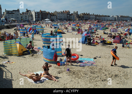 Weymouth Dorset England UK Tourists on the beach in this popular west country town on the south coast Stock Photo