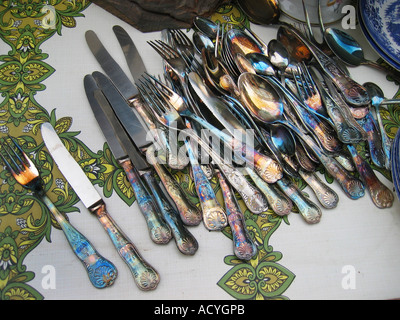 collection of decorative silverware at flee market England Stock Photo