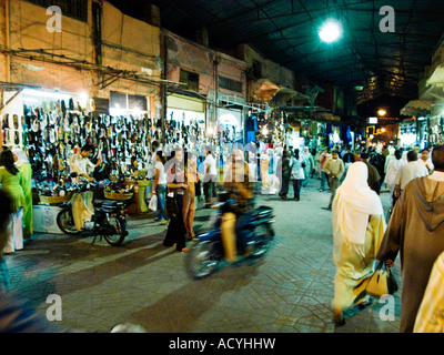 Nighttime activity in the souks around Jemaa el Fna square in Marrakesh,Morocco Stock Photo
