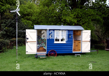 A traditional shepherds hut beside Nutley windmill on the edge of Ashdown Forest in Sussex Stock Photo