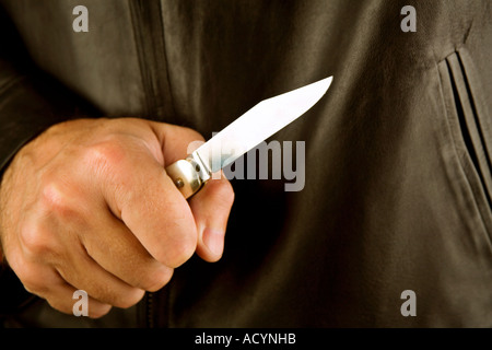 Man holding a flicknife Stock Photo