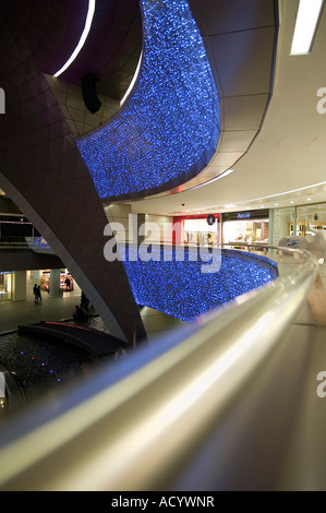 Night time at Kanyon, the futuristic shopping centre in Istanbul, Turkey. The curving shops and walkways have an strong organic Stock Photo