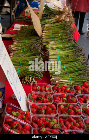 Asparagus and strawberries for sale on a French Market, Herault. Languedoc Roussillon region of the south of France Stock Photo