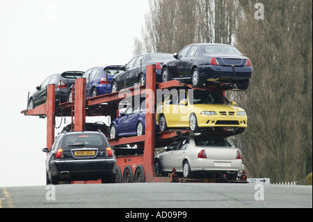 A car transporter carrying Rover cars leaves the MG Rover factory in Longbridge Birmingham UK 1 May 2004 Stock Photo