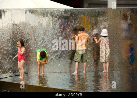 England Bristol Millennium Square children cooling down in water feature Stock Photo