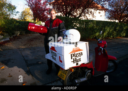 Pizza Hut Delivery Man and Motorbike Surrey England Stock Photo