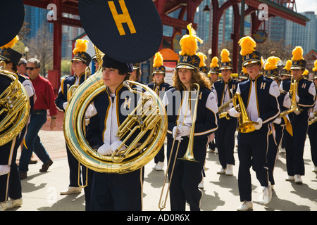 CHICAGO Illinois Male and female marching band members in uniform walk at Navy Pier feathers on hats and high school colors Stock Photo