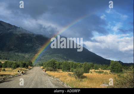 Rainbow over Patagonian steppe and lonely road, Lanin National Park, Neuquen Province, Argentina Stock Photo