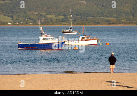 Evening on the Dovey estuary, Aberdovey, Wales, June 2007 with man on beach watching. Stock Photo