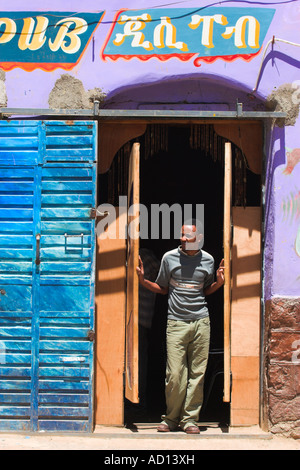 Ethiopia, Harar, Street in the old city, Man standing in doorway of pub Stock Photo