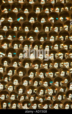 Vertical abstract close up of mirrored glass tiles making up an elaborate mosaic. Stock Photo