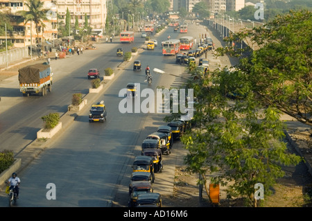 Horizontal wide angle aerial view of a typical Indian streetscene with rickshaws queueing on the road Stock Photo