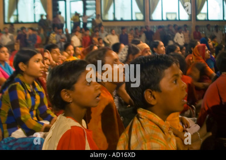 Horizontal view of crowds of Indian children engrossed in the Ramayana play performed inside the Jehangir Palace in Orchha. Stock Photo