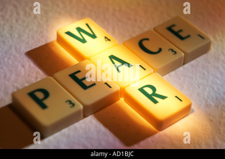 SCRABBLE BOARD GAME LETTERS SPELLING THE WORDS WAR AND PEACE Stock