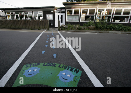 School crossing marked with instuctions Stop Look Listen Stock Photo