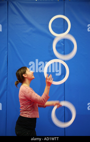 Girl juggling rings in the Hoxton circus space in London Stock Photo