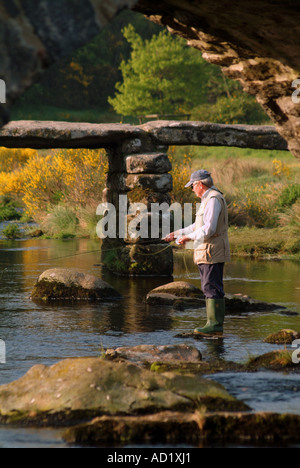 Fly fisherman on the river Dart Postbridge Dartmoor Devon UK Stock Photo