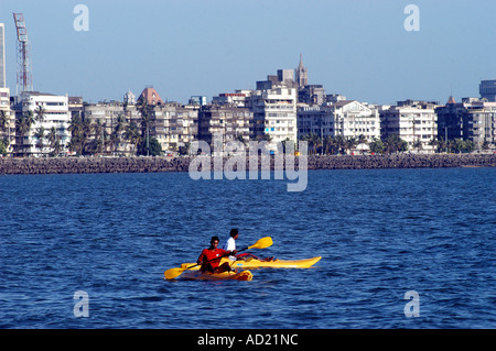 Two men canoeing in Arabian sea off Marine Drive in Bombay now Mumbai Maharashtra India Stock Photo
