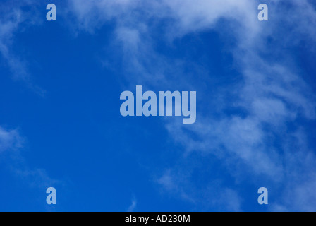 Light clouds against a deep blue sky Stock Photo