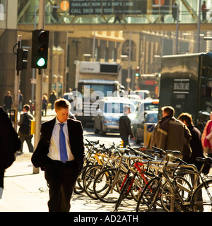 Going to work early morning office workers walking towards London Bridge from Tooley Street 2007 Stock Photo