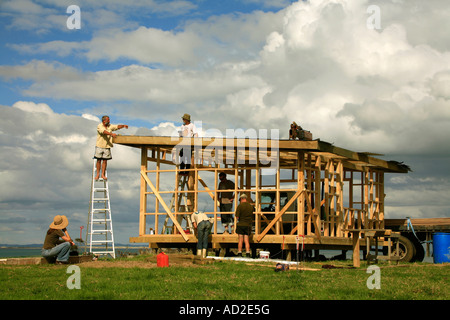 A group of friends build a holiday bach or shack near Potou Northland New Zealand Stock Photo