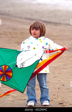 A pre-K female child holding a kite Stock Photo