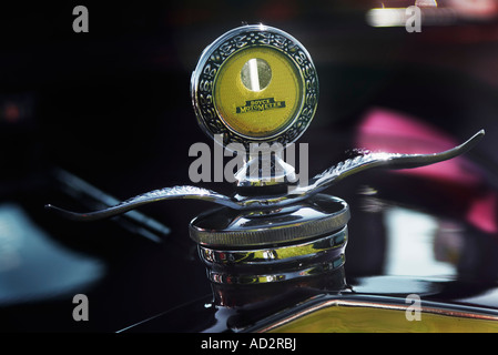 Closeup of a Boyce Moto Meter radiator motor temperature indicator with wing cap on an antique vehicle Stock Photo