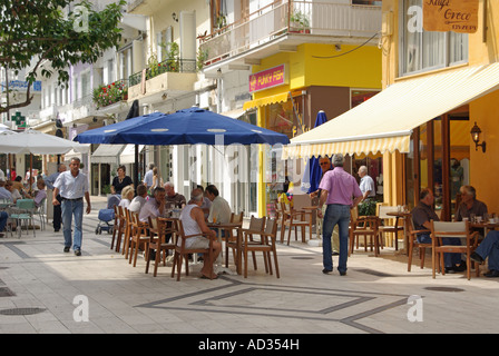 Igoumenitsa pedestrianised street people relaxing at pavement bars Stock Photo