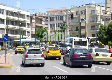 Athens Greece cars and single deck bus in slow moving traffic queue on one of the busy Greek main roads Stock Photo