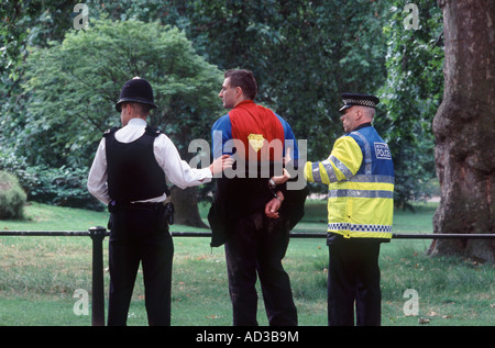 Superman — Fathers for Justice protester — held by two London Metropolitan police officers, Trooping the Colour, 2007 Stock Photo