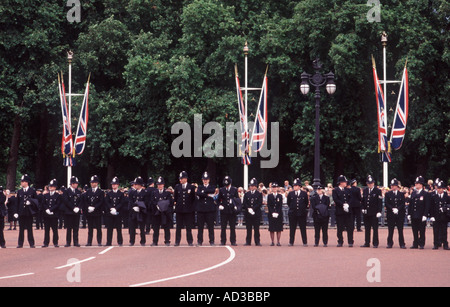 Thin Blue Line: London Metropolitan police officers forming protective line across the top of The Mall, Trooping the Colour Stock Photo