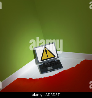 LAP TOP COMPUTER TRAPPED INTO CORNER OF ROOM BY FRESH WET PAINT ON FLOOR Stock Photo