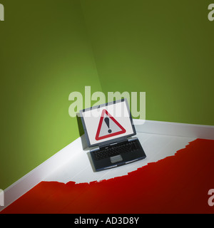 LAP TOP COMPUTER TRAPPED INTO CORNER OF ROOM BY FRESH WET PAINT ON FLOOR Stock Photo