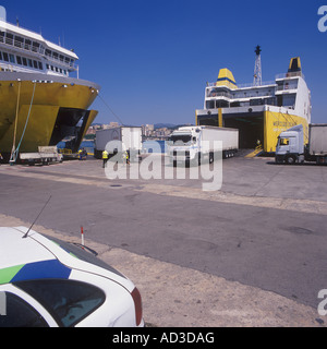 Cargo operations, lorries and containers being loaded onto ferries in the port of Palma de Mallorca. Stock Photo