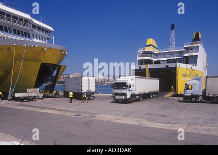 Cargo operations, lorries and containers being loaded onto ferries in the port of Palma de Mallorca. Stock Photo